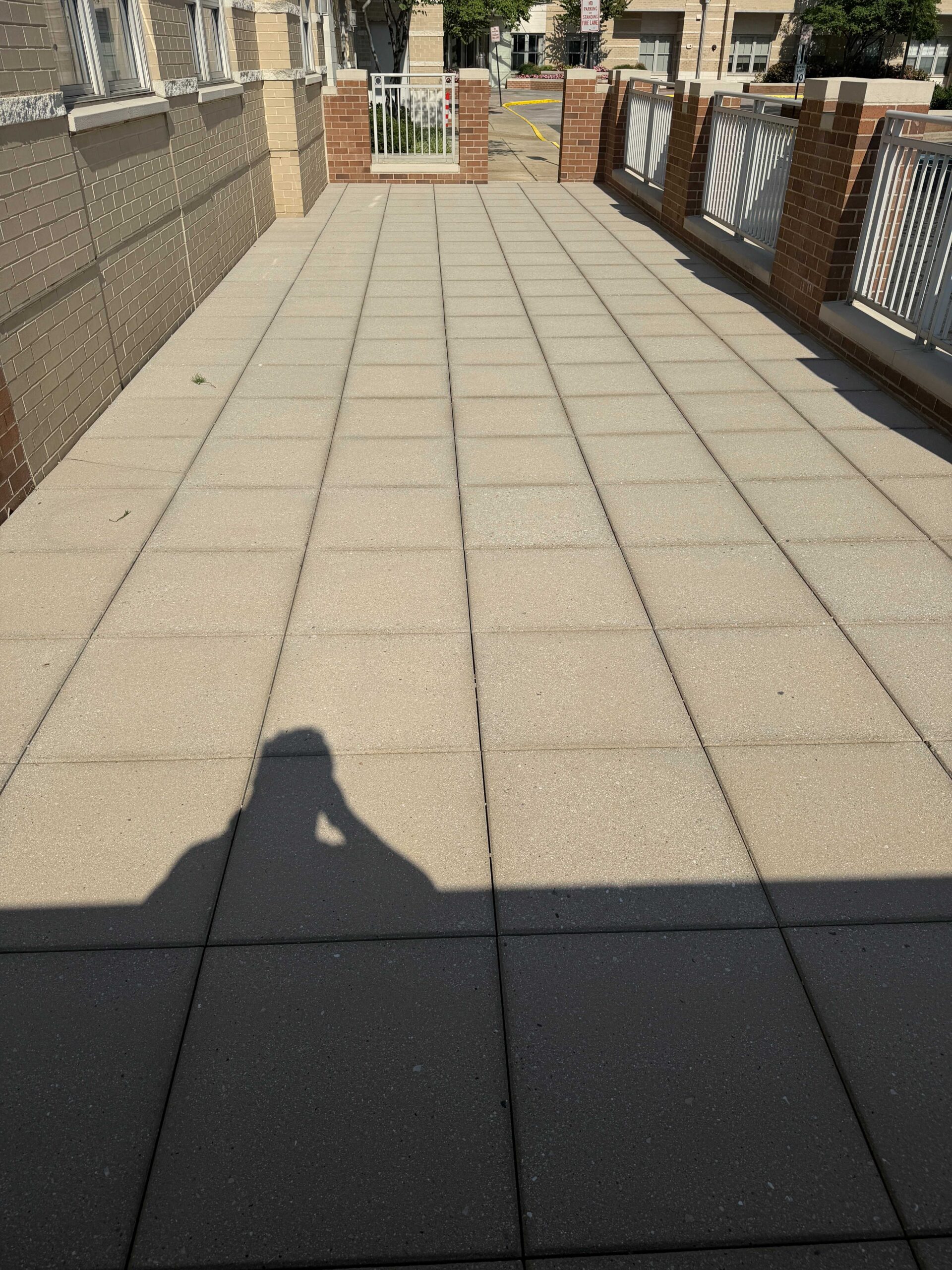 Pressure washing a commercial sidewalk and entrance area