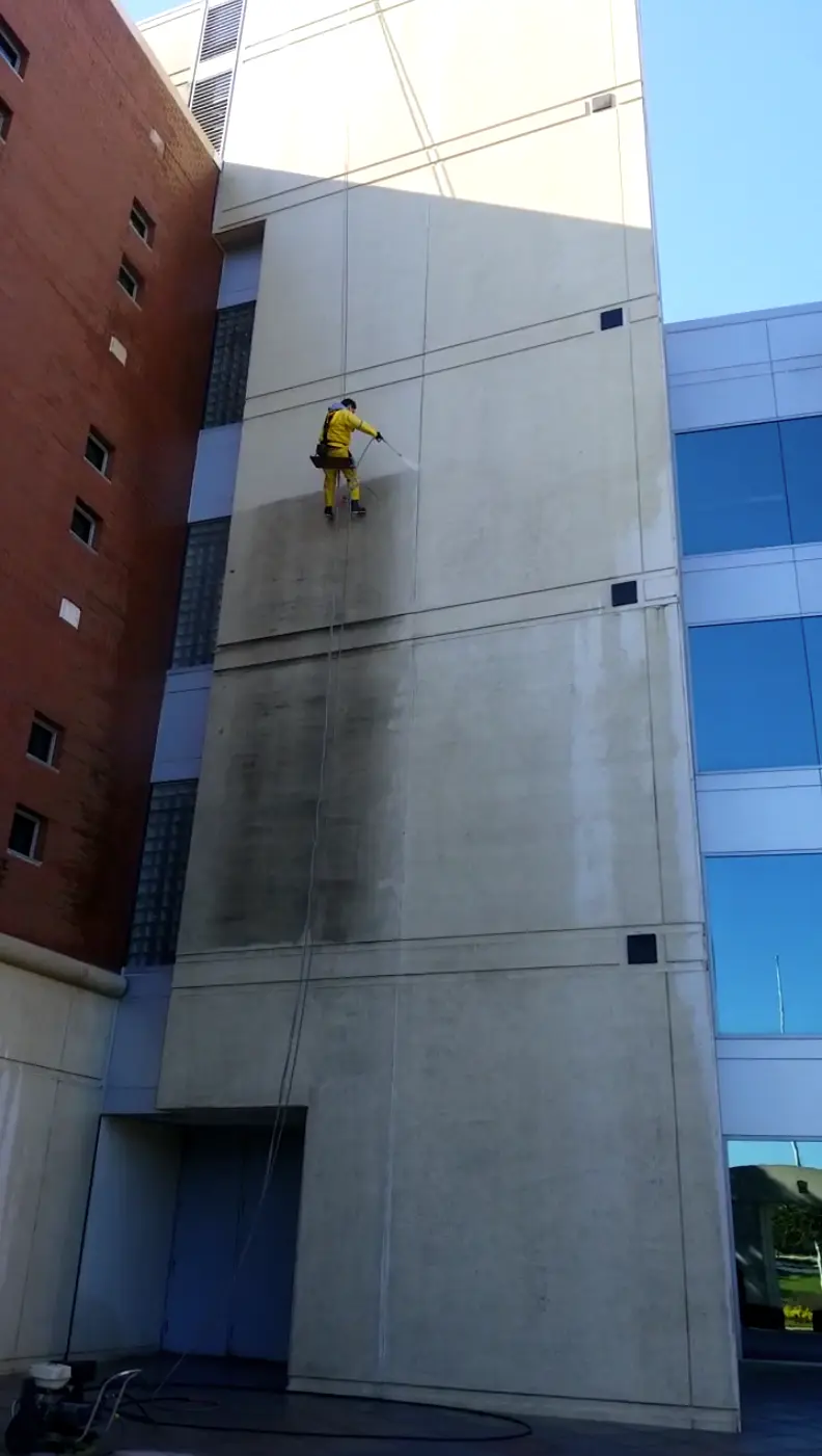 Commercial facade surface shown during a Top of the Line cleaning project