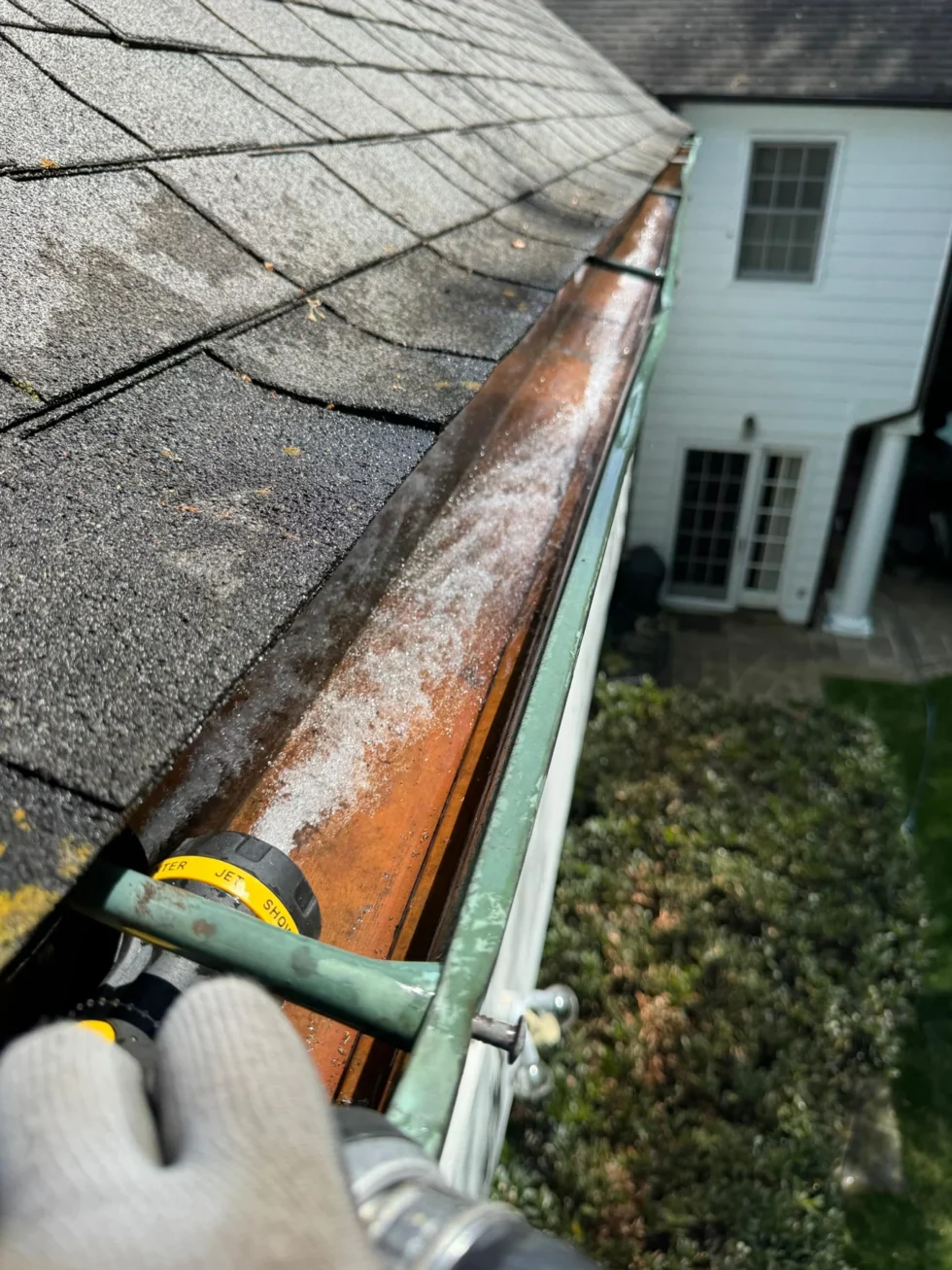 Close view of a copper gutter along a residential roofline
